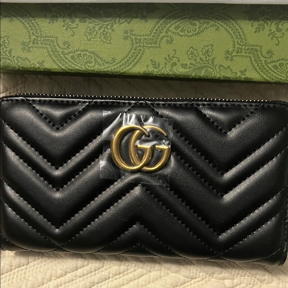 Gucci Handbags - Gucci Black Quilted Leather Zip-Around Wallet with Gold Double G Hardware